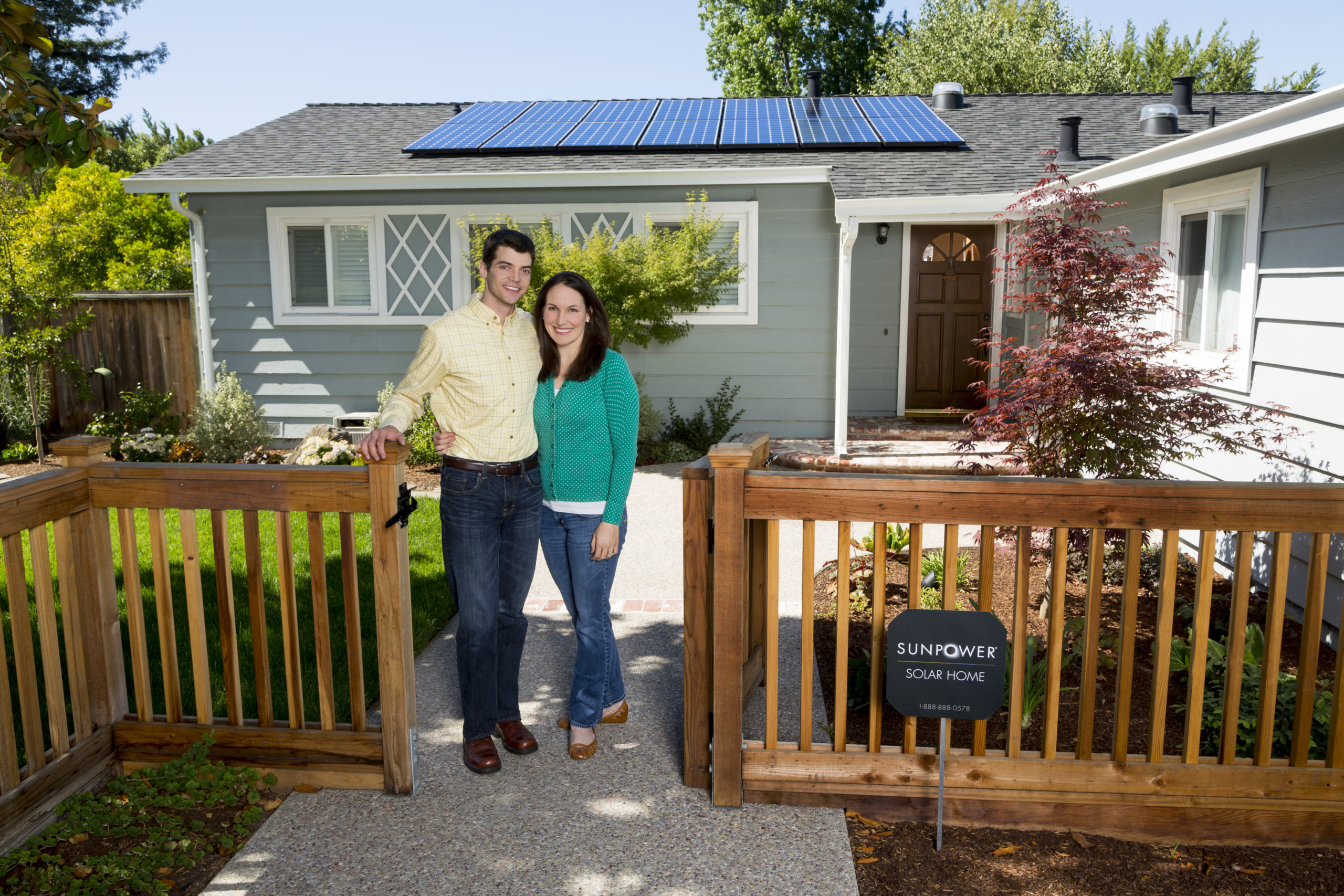 Happy Couple With Solar Panels